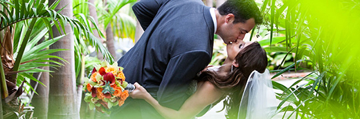 Bride and groom kissing.