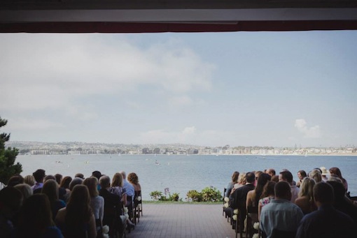 A wedding ceremony at The Garty Pavilion on Mission Bay full of guests.