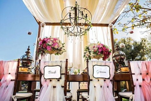 Couples chairs and table for reception at a San Diego wedding by Brilliant Event Design.