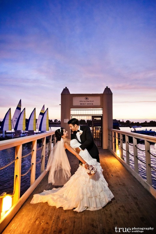 A couple on the boat docks at the Hilton San Diego Resort & Spa.