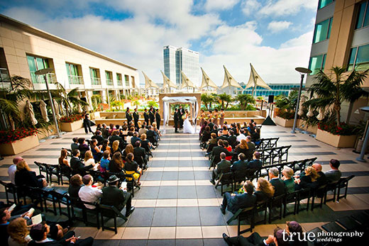 A wedding taking place on the outdoor terrace at Omni Hotel San Diego