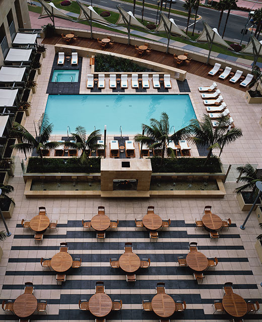 A birds eye view of the outdoor terrace and heated pool at the Omni Hotel San Diego