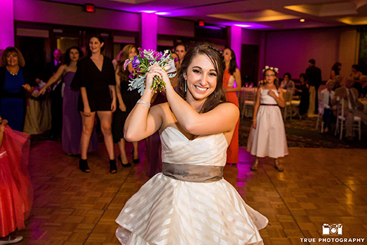 Bride Posing Before Bouquet Toss