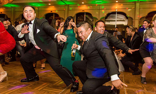 Groomsmen Dancing Low on the Dance Floor